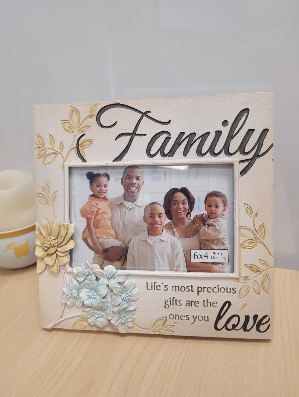 Cream-colored decorative tabletop picture frame